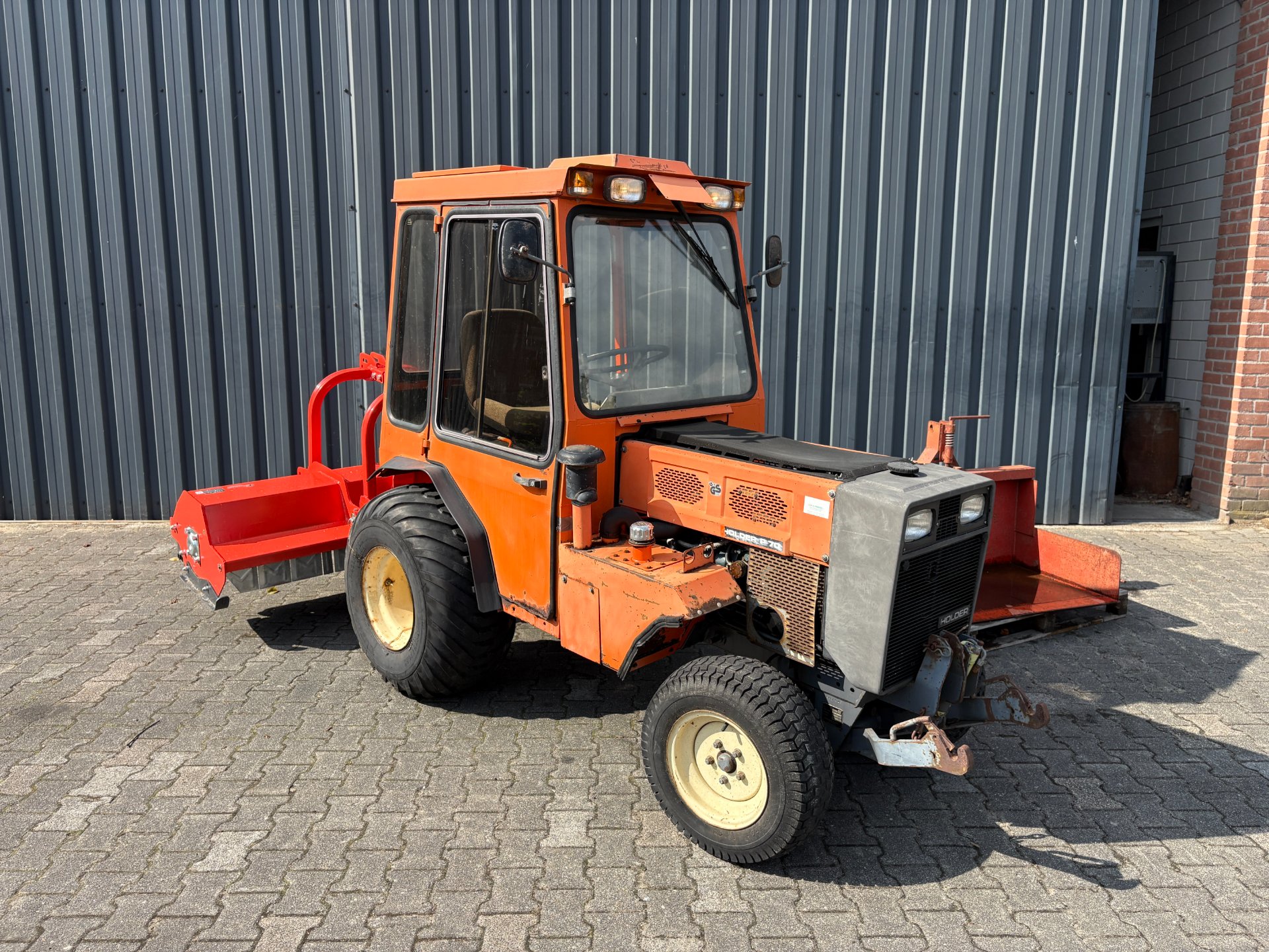 Holder P70 COMBI-DEAL met klepelmaaier en grondbak